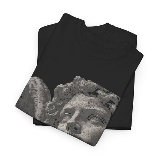 Close-up of the stone angel print on the folded black Sentinels Tee by DJ Orbit One